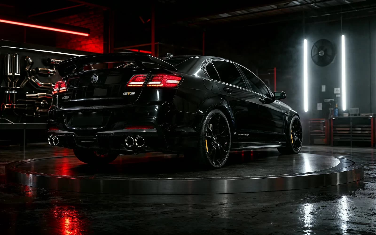 HSV GTS performance exhaust system in a dark premium workshop